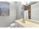 Bathroom with a tiled shower/tub combo, vanity with marble counter, and window with wood blinds at 15104 Azra Dr, Odessa, FL 33556