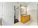 Bathroom featuring a vanity, a shower, and wood-look flooring at 15104 Azra Dr, Odessa, FL 33556