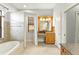 Bathroom featuring a vanity, a tub, and a view of the backyard at 15104 Azra Dr, Odessa, FL 33556