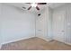 Bedroom featuring a ceiling fan and closet with double doors at 15104 Azra Dr, Odessa, FL 33556