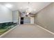Spacious bonus room with neutral carpet, chandelier lighting, and unique architectural details at 15104 Azra Dr, Odessa, FL 33556