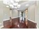 Bright dining room boasts hardwood floors, modern lighting, and sliding glass doors leading to the outdoor patio at 15104 Azra Dr, Odessa, FL 33556