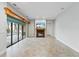 Living room featuring tile flooring, a fireplace, and doors to the backyard pool at 15104 Azra Dr, Odessa, FL 33556