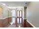 The living room features sleek hardwood floors and an open floor plan with natural light at 15104 Azra Dr, Odessa, FL 33556