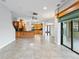 Spacious open-concept living area features tile floors and an eat-in kitchen with barstool seating at 15104 Azra Dr, Odessa, FL 33556