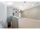 This carpeted living room boasts high ceilings and bright lighting fixtures at 15104 Azra Dr, Odessa, FL 33556