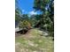 Screened lanai and landscaped backyard provides a serene outdoor space at 1600 Still River Dr, Venice, FL 34293