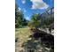 Screened lanai and landscaped backyard provides a serene outdoor space at 1600 Still River Dr, Venice, FL 34293