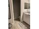Bathroom featuring a single vanity with granite countertops and white cabinets at 1600 Still River Dr, Venice, FL 34293