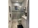 Bathroom featuring a glass shower, a tiled shower, and granite countertops at 1600 Still River Dr, Venice, FL 34293