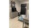 This bedroom features laminate floors, a bunk bed with stairs, a desk, and soft neutral colors at 1600 Still River Dr, Venice, FL 34293