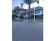 Clubhouse with a well-manicured lawn and convenient street access at 1600 Still River Dr, Venice, FL 34293