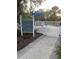 Entrance to the Paws Park dog park for small dogs, with a gate and sign outlining the rules at 1600 Still River Dr, Venice, FL 34293