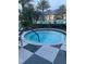Inviting hot tub with tiling surrounding the exterior at 1600 Still River Dr, Venice, FL 34293