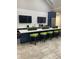 Kitchenette with modern cabinetry, countertop, and barstool seating in a modern space at 1600 Still River Dr, Venice, FL 34293