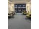 Community library with ample seating and a wide selection of books on display at 1600 Still River Dr, Venice, FL 34293