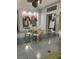 Well-lit lounge area featuring comfortable seating and a community activity board at 1600 Still River Dr, Venice, FL 34293