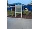Community pickleball courts with rules signage, open for daytime drink service at 1600 Still River Dr, Venice, FL 34293