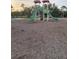 Community playground with slides and play equipment surrounded by a mulch ground cover at 1600 Still River Dr, Venice, FL 34293