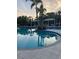 Inground pool with shaded cabanas nearby at 1600 Still River Dr, Venice, FL 34293