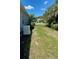 Side yard featuring a home generator at 1600 Still River Dr, Venice, FL 34293