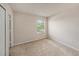 Neutral bedroom with carpet flooring and window view at 1605 Acorn Seed Ct, Valrico, FL 33594