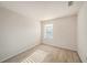 Bedroom with neutral walls, carpet flooring and a large window at 1605 Acorn Seed Ct, Valrico, FL 33594