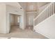 Spacious foyer boasting soaring ceilings, a staircase, and access to a study or office at 1605 Acorn Seed Ct, Valrico, FL 33594