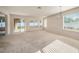 Bright living room with sliding glass doors providing natural light and backyard views at 1605 Acorn Seed Ct, Valrico, FL 33594