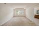 Spacious main bedroom featuring a tray ceiling and adjoining bathroom at 1605 Acorn Seed Ct, Valrico, FL 33594