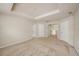 Large main bedroom with a tray ceiling and multiple entry doors at 1605 Acorn Seed Ct, Valrico, FL 33594