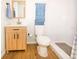 Bright bathroom features wood vanity, with a large mirror, modern fixtures, and blue towels at 1933 Oxnard Ct, Tampa, FL 33612