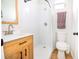Modern bathroom features a wood vanity, white finishes, and updated shower head at 1931 Oxnard Ct, Tampa, FL 33612
