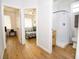 Hallway showcasing access to bedrooms with bright windows and a bathroom featuring a shower and modern fixtures at 1933 Oxnard Ct, Tampa, FL 33612