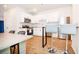 Modern kitchen featuring white cabinets, granite counters, stainless appliances and eat in bar at 1931 Oxnard Ct, Tampa, FL 33612