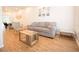 Bright living room with a neutral color palette, hardwood floors, and modern furniture at 1931 Oxnard Ct, Tampa, FL 33612