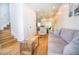 Open concept living room with hardwood floors featuring neutral decor, and modern finishes at 1933 Oxnard Ct, Tampa, FL 33612
