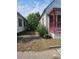 The side yard area between two houses with plants and grass at 1935 W Union St, Tampa, FL 33607
