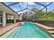 The property includes a screened pool area with a rectangular pool and an outdoor seating area at 21215 Preservation Dr, Land O Lakes, FL 34639