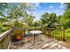 Backyard deck overlooking scenic lake with table and chairs for outdoor enjoyment at 21215 Preservation Dr, Land O Lakes, FL 34639