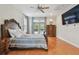 Primary bedroom featuring hardwood floors and direct access to the outdoor pool at 21215 Preservation Dr, Land O Lakes, FL 34639