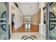 Inviting foyer with hardwood floors, decorative tile, and arched doorways at 21215 Preservation Dr, Land O Lakes, FL 34639