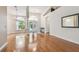 Open-concept living area featuring wood floors, high ceilings, and natural light at 21215 Preservation Dr, Land O Lakes, FL 34639
