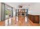 Cozy living room with stone fireplace, hardwood floors, and french door access to lanai at 21215 Preservation Dr, Land O Lakes, FL 34639