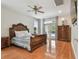 Spacious main bedroom with wood floors, elegant furnishings, and access to outdoor area at 21215 Preservation Dr, Land O Lakes, FL 34639