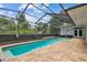 A backyard pool in screened enclosure with patio and access to the home at 21215 Preservation Dr, Land O Lakes, FL 34639