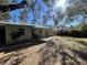 A spacious backyard featuring a lawn and patio, ideal for outdoor relaxation and entertaining at 2221 York S St, Gulfport, FL 33707