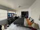 Bedroom featuring tile flooring, TV, closet, and natural light at 2221 York S St, Gulfport, FL 33707