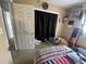 Bedroom with simple closet, twin bed, and neutral tones at 2221 York S St, Gulfport, FL 33707