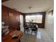 Dining room with wooden paneling and tiled floors at 2221 York S St, Gulfport, FL 33707